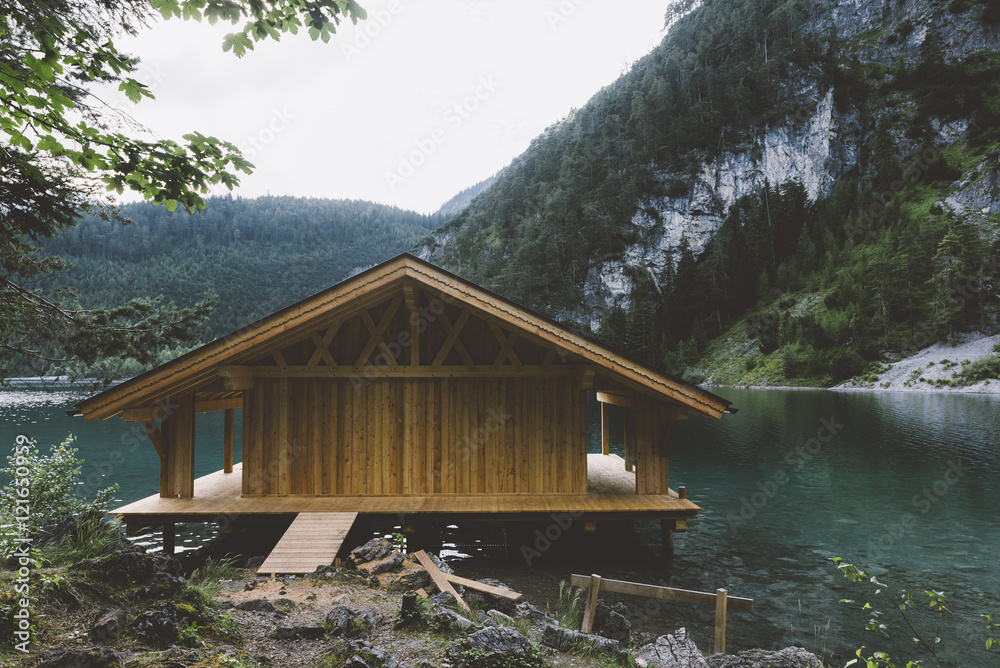 Fototapeta Wood house on lake with