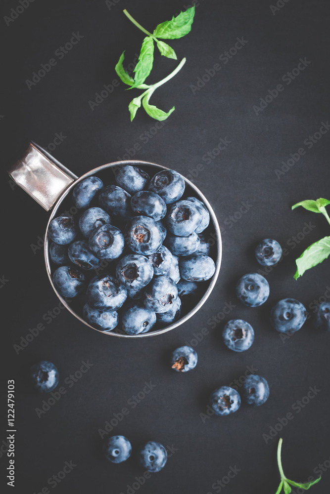 Obraz Tryptyk Blueberry on black background.