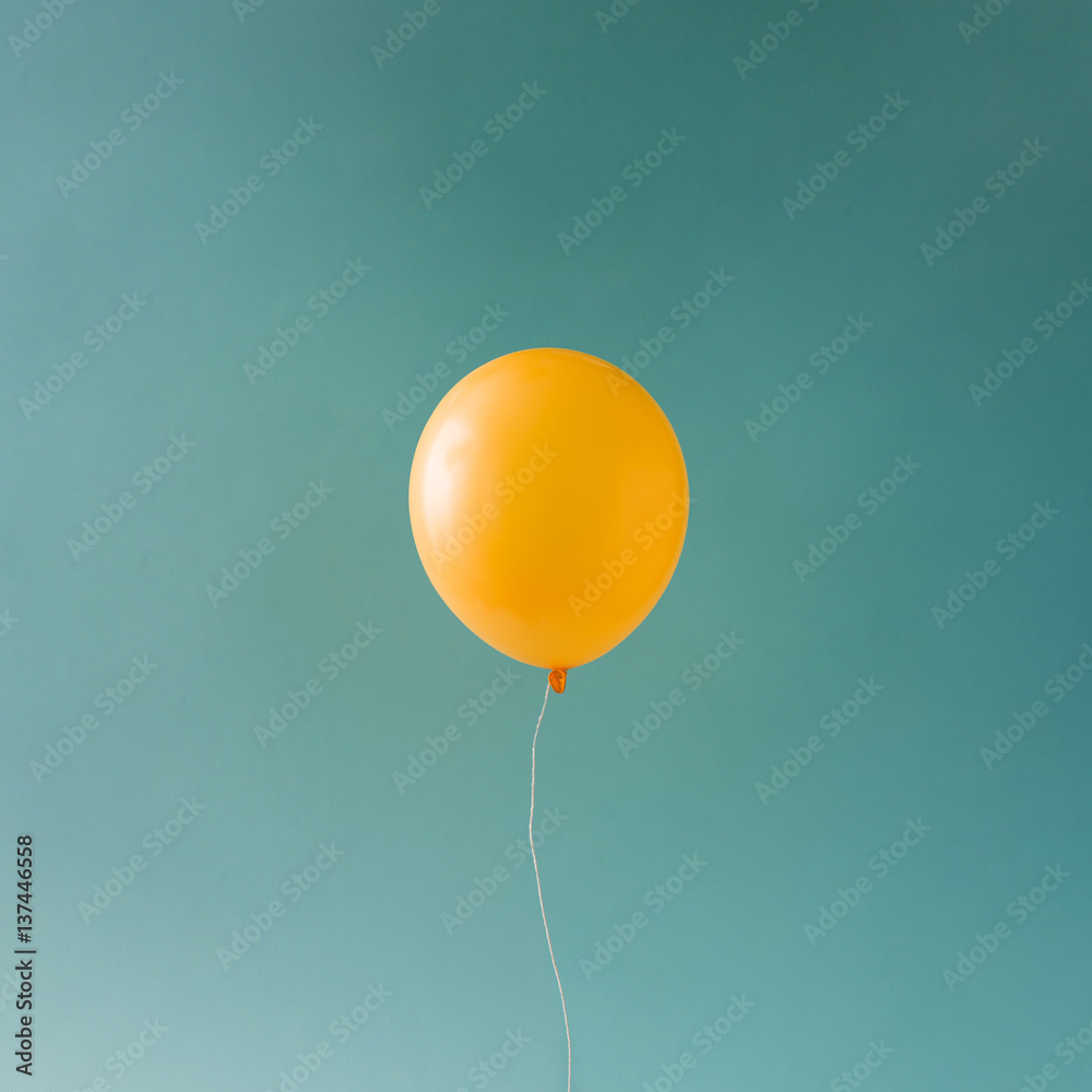 Obraz na płótnie Yellow balloonon blue sky.
