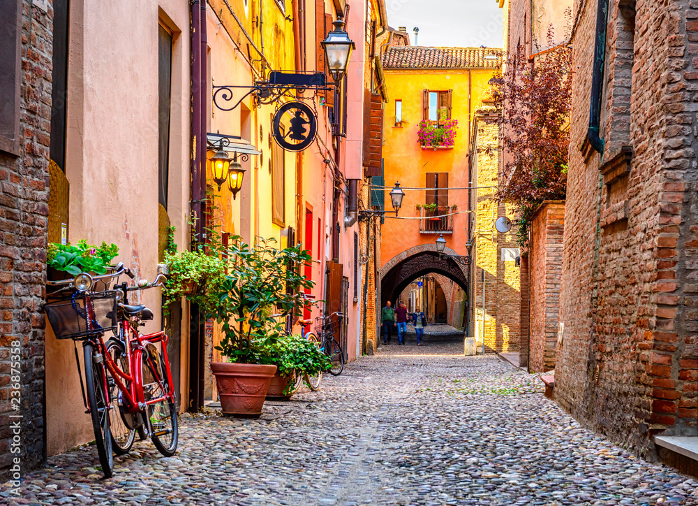Fototapeta Cozy narrow street in Ferrara,
