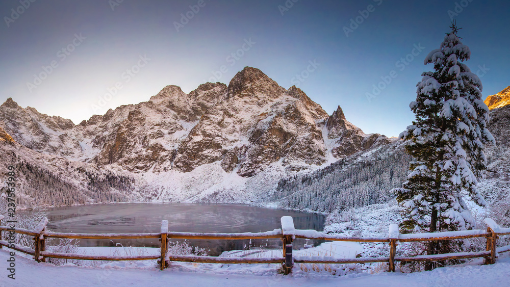 Fototapeta Winter mountains with icy lake