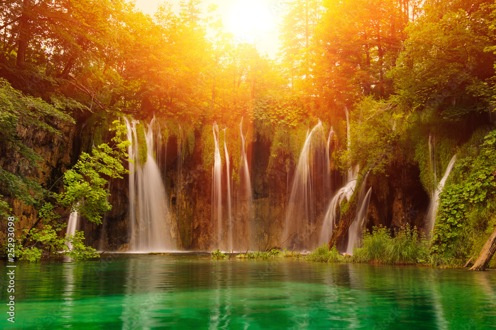 Obraz Tryptyk Waterfalls in national park.