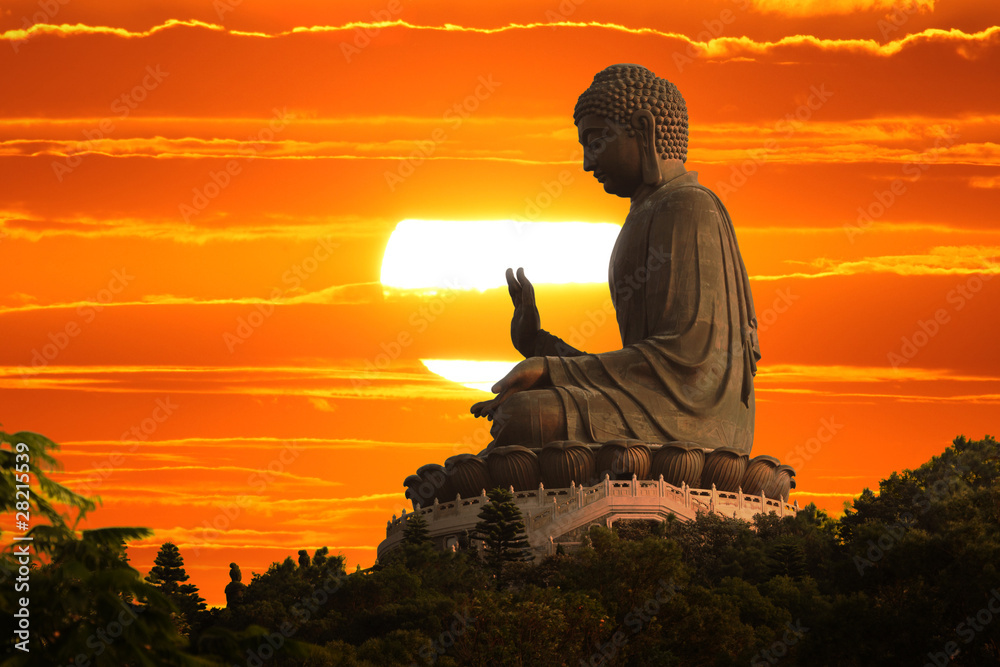 Fototapeta Buddha statue at sunset