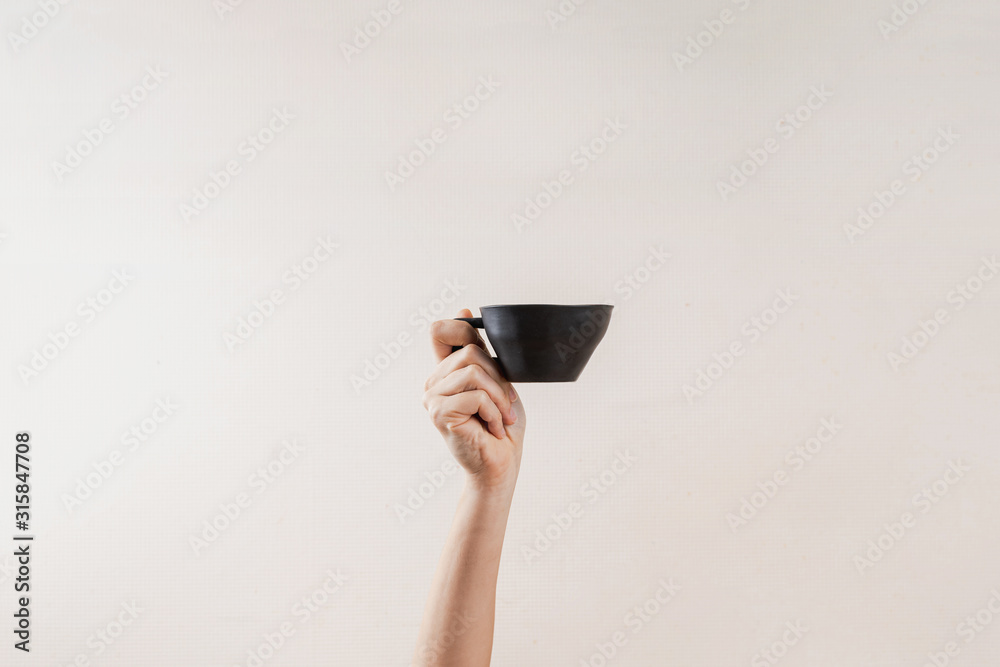 Obraz Kwadryptyk Hand with black cup with