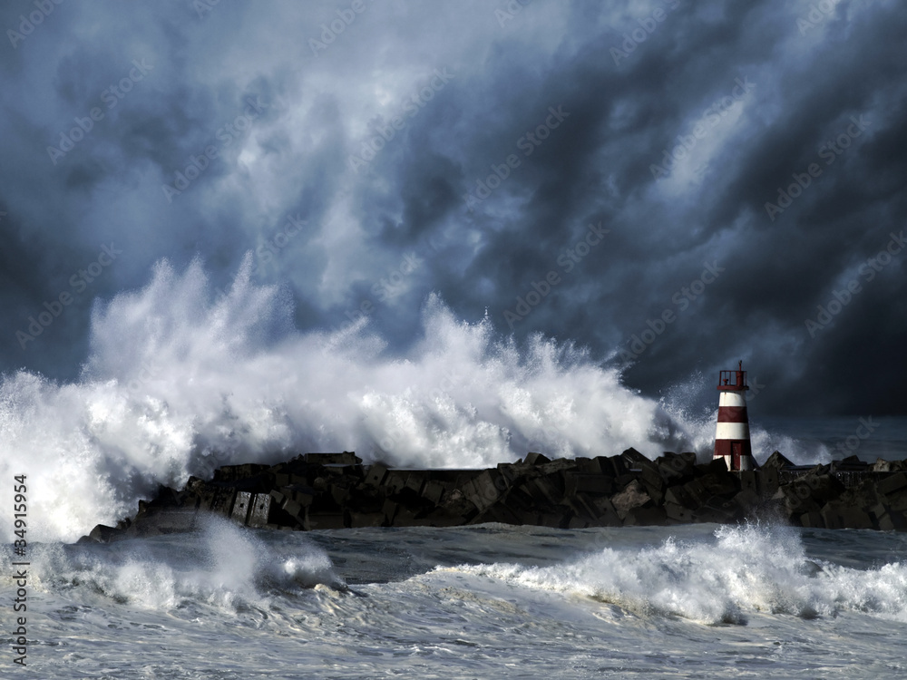 Obraz na płótnie Stormy waves against beacon