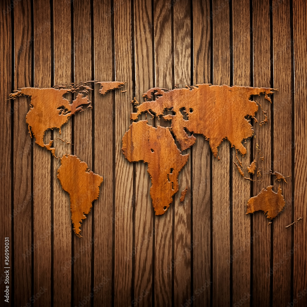 Fototapeta world map carving on wood
