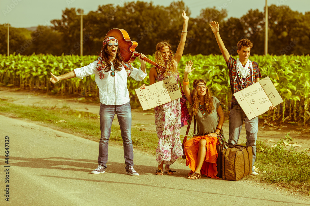 Fototapeta Hippie Group Hitchhiking on a