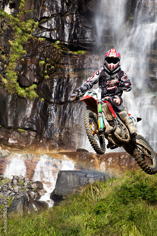 Fototapeta motocross with waterfall