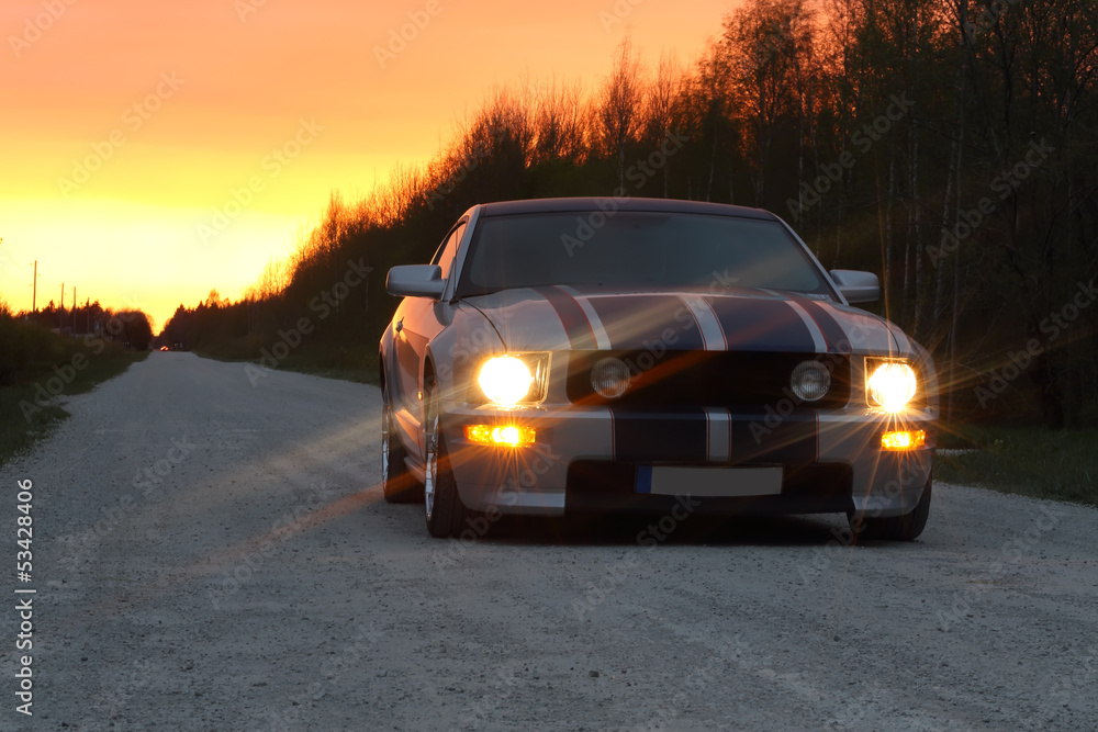 Obraz Tryptyk Sport car on the night road