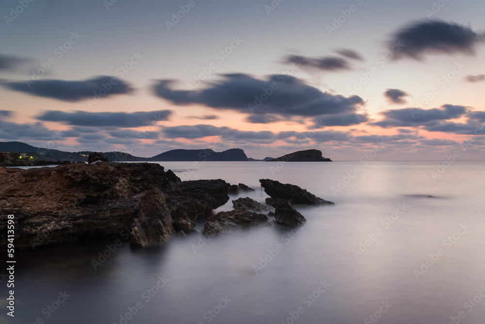 Obraz Tryptyk Sunrise over rocky coastline