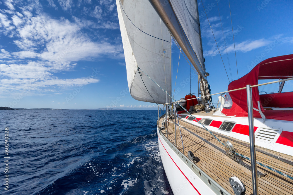 Fototapeta Sailing yacht in blue sea