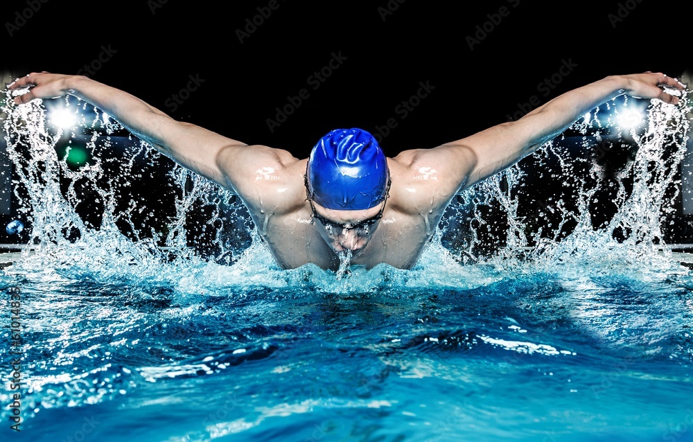Fototapeta Muscular young man in blue cap