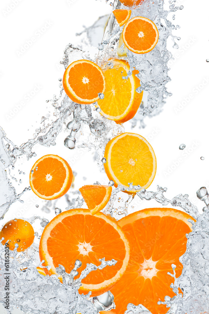 Fototapeta Fresh oranges falling in water