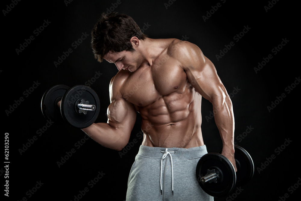 Fototapeta Muscular bodybuilder guy doing