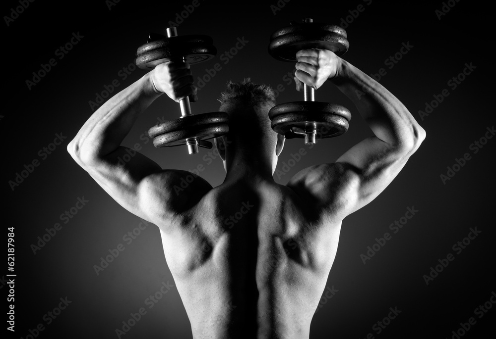 Fototapeta Muscular man weightlifting