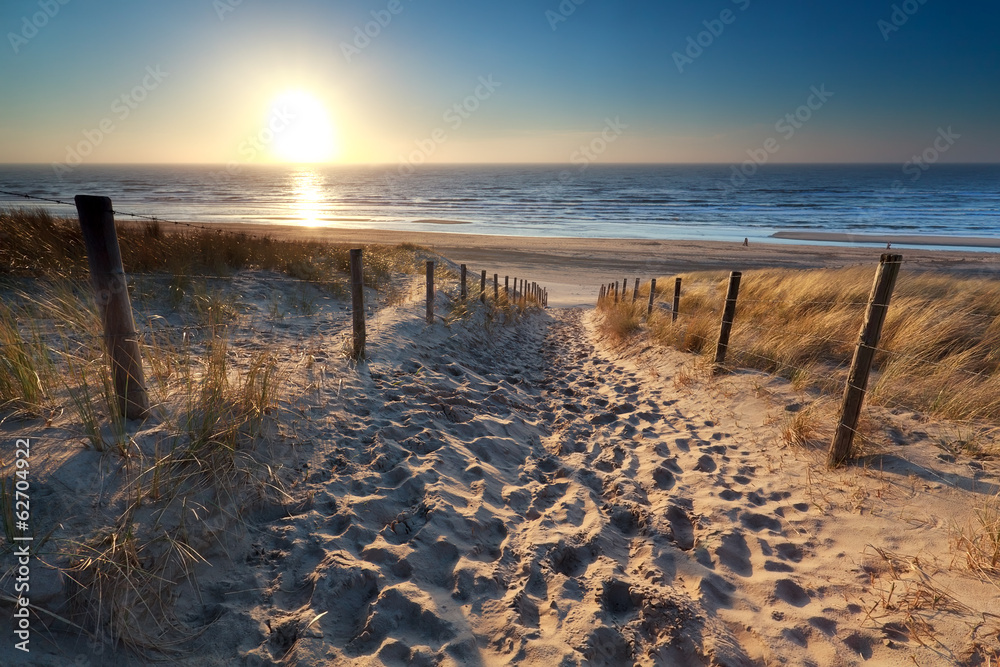 Obraz Dyptyk sunshine over path to beach in