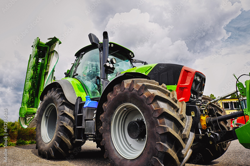 Fototapeta farming tractor and plough,