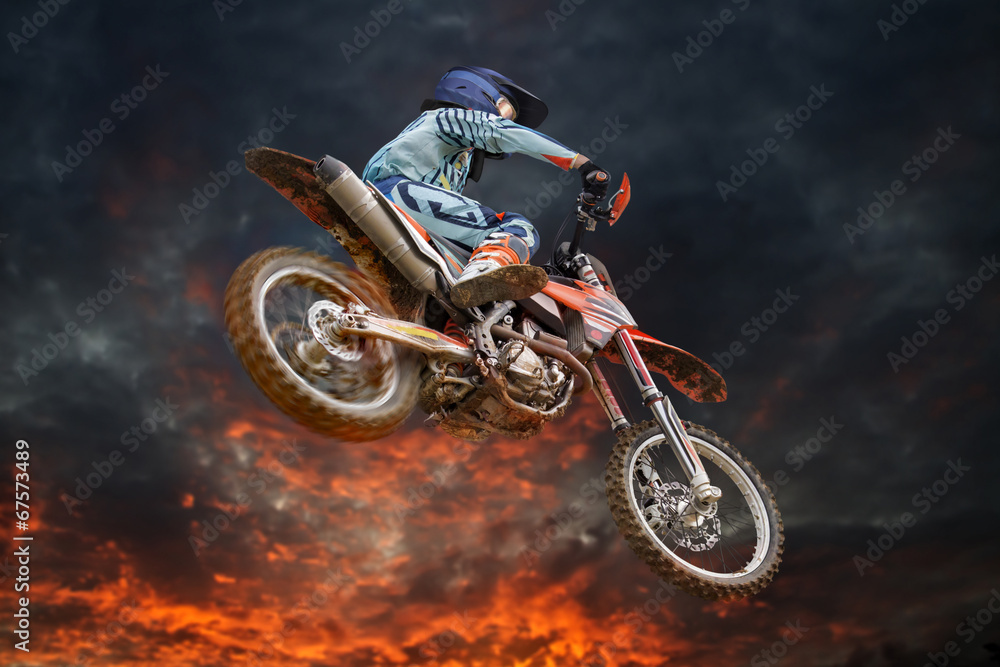 Fototapeta Flying motocross rider fire
