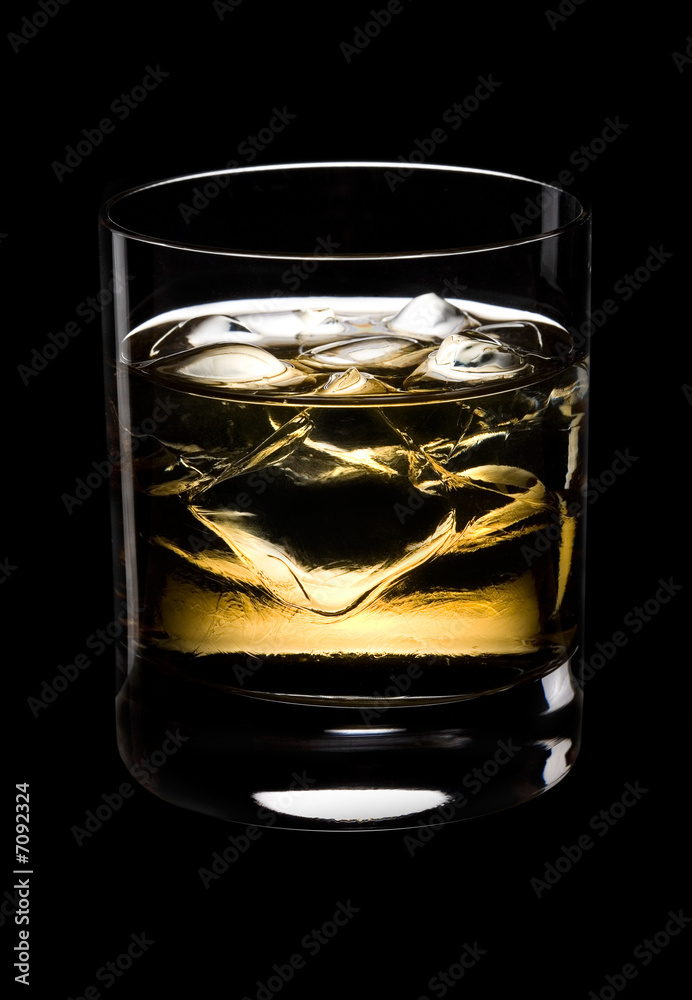 Fototapeta Glass of whisky on a black