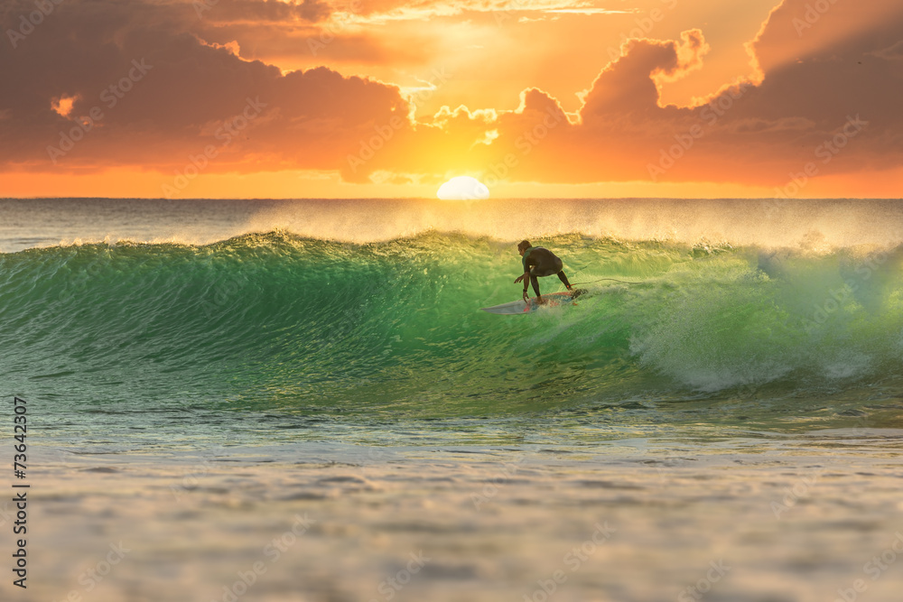Fototapeta Surfer Surfing at Sunrise