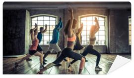 Fototapeta Workout in a fitness gym