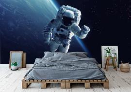 Fototapeta Astronaut at spacewalk. Cosmic