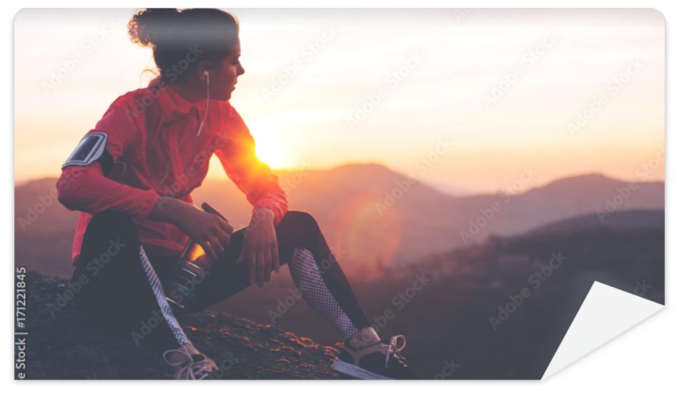 Fototapeta Athletic woman resting after a