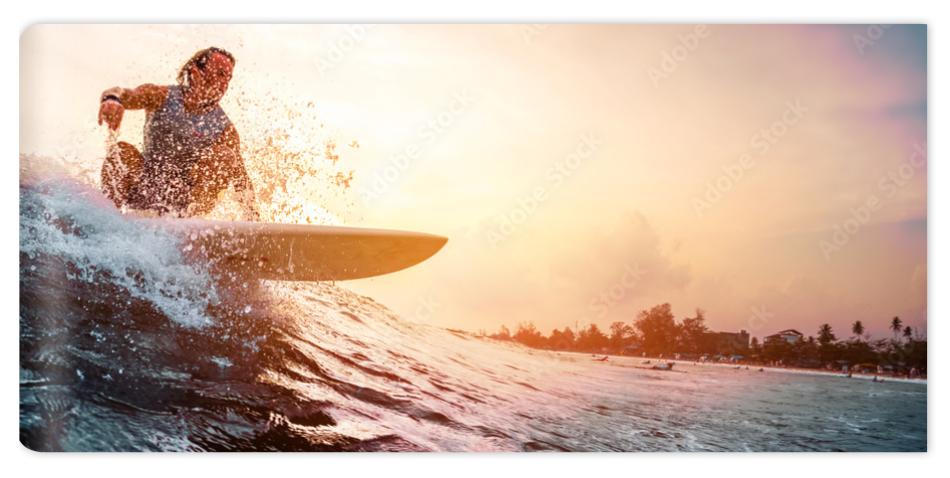 Fototapeta Surfer rides the ocean wave