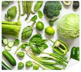 Fototapeta Green vegetables on a wooden