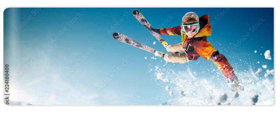 Fototapeta Skiing. Jumping skier. Extreme