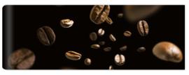 Fototapeta Coffee beans in flight on a