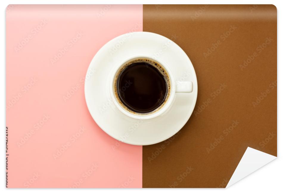 Fototapeta Coffee cup isolated on brown