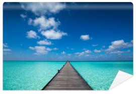 Fototapeta Wooden pier with blue sea and