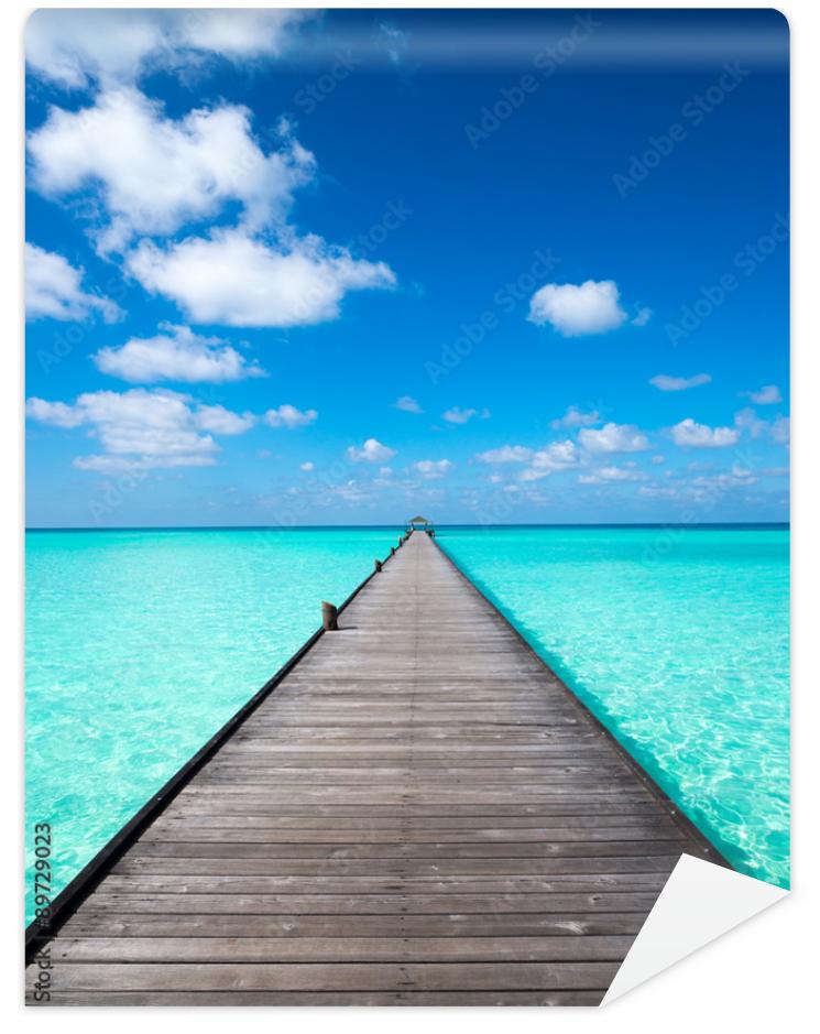 Fototapeta Wooden pier with blue sea and