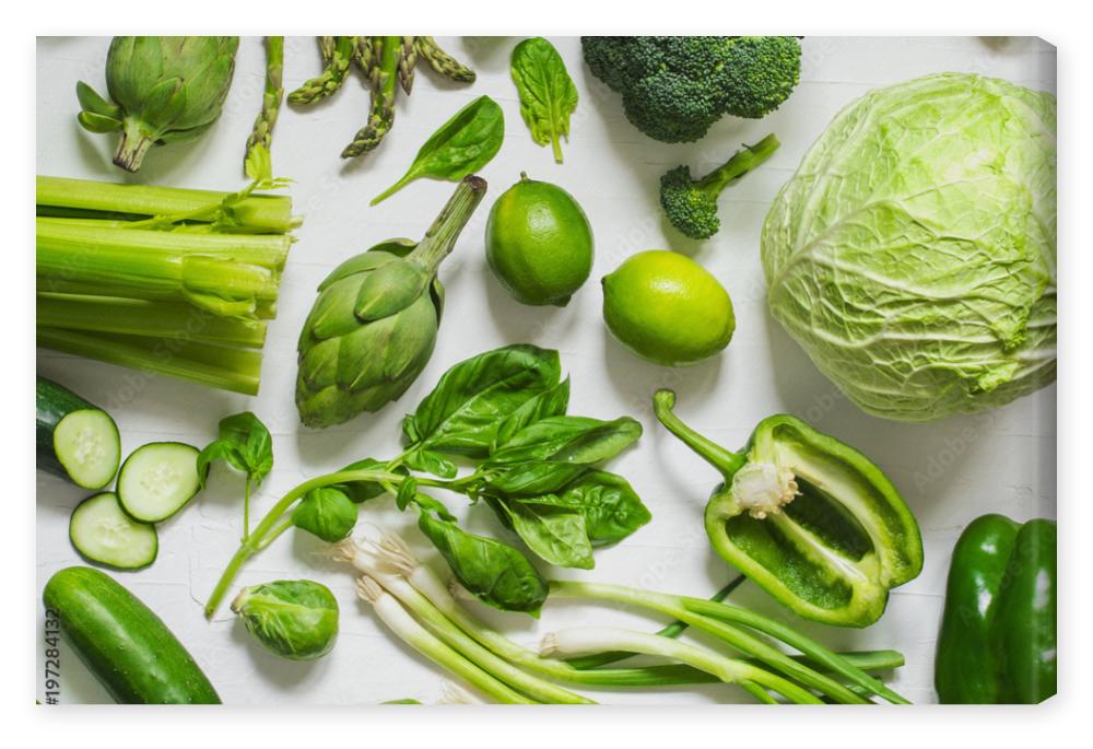 Obraz na płótnie Green vegetables on a wooden