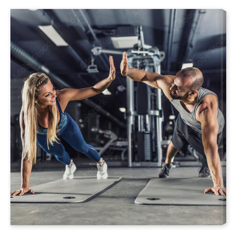 Obraz na płótnie Sport couple doing plank