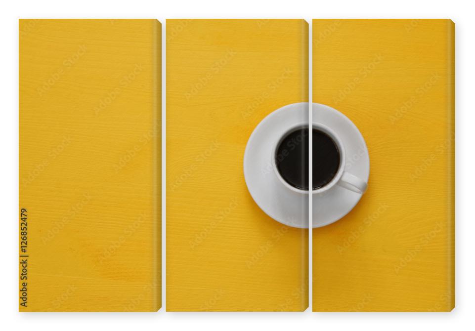 Obraz Tryptyk coffe cup on wooden yellow